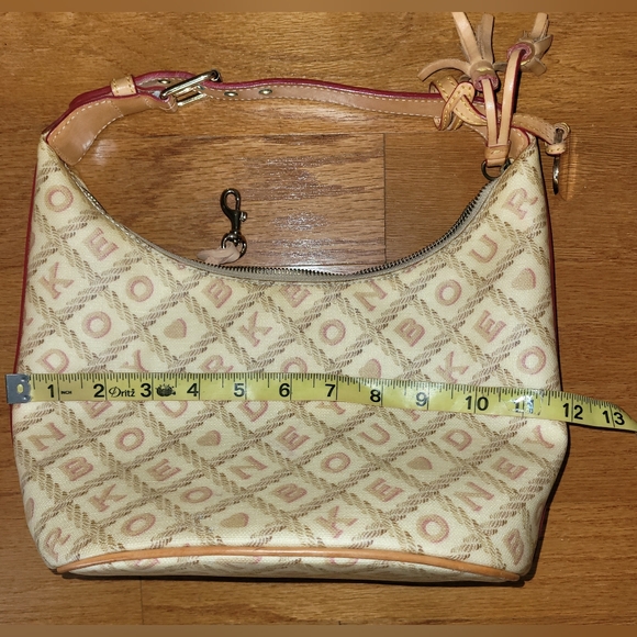 Dooney & Bourke Coated Canvas Signature Logo Charm Bucket Bag, Ivory - Picture 12 of 12